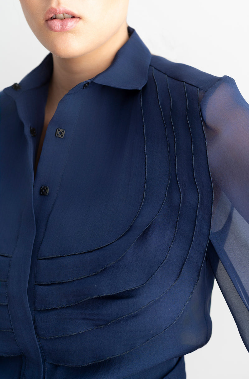 Blusa de organza azul con volantes