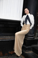 Falda larga dorada drapeada