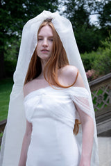 Dress in silk crêpe with crossed plumetis tulle straps and an open back