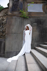 Dress in silk crêpe with crossed plumetis tulle straps and an open back